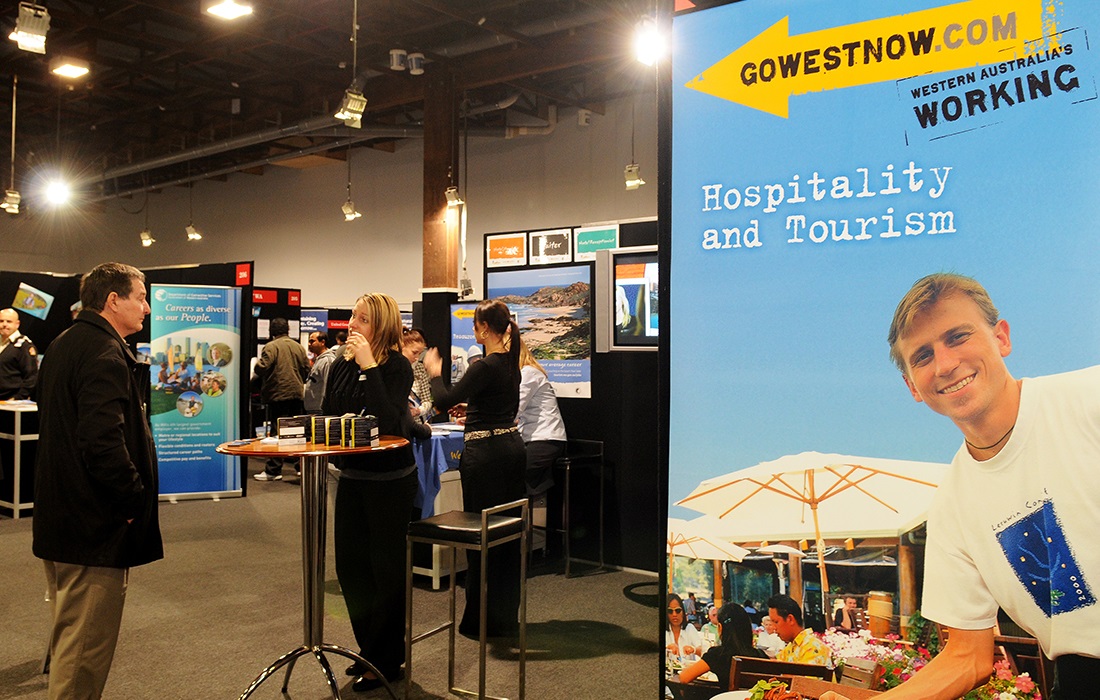 Photo of a Go West Now promotional banner at an expo.